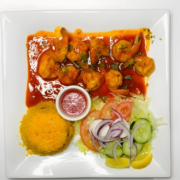 Mister Taco's shrimp dish with red sauce, yellow rice, a side salad, and a small bowl of salsa.