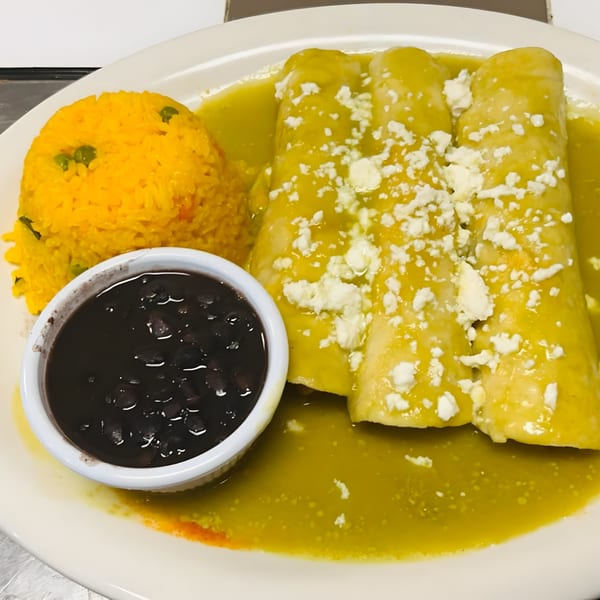 Three green enchiladas topped with cheese, served with yellow rice and a side of black beans.